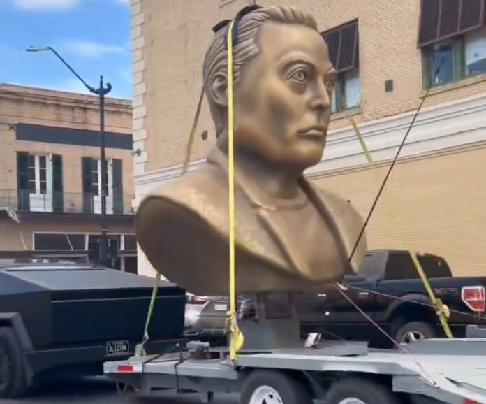 tesla-cybertruck-towing-elon-musk-statue.jpg