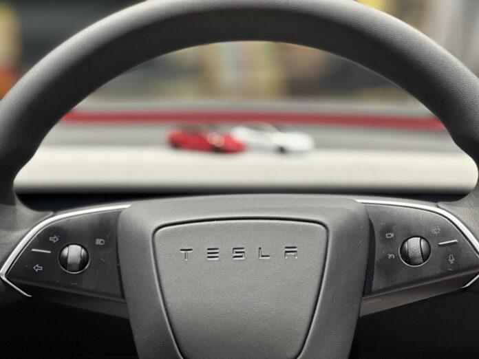 tesla-steering-wheel-logo-scaled.jpeg